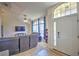 Inviting living room with high ceilings, large windows, plush seating, and abundant natural light at 2850 Babylon Ct, Oviedo, FL 32765