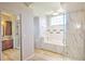Bright, expansive bathroom with a soaking tub, a glass-enclosed shower, and dual sinks at 2850 Babylon Ct, Oviedo, FL 32765