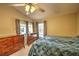 Bright main bedroom showcasing neutral paint, ceiling fan, and ample space for dressers and storage at 2850 Babylon Ct, Oviedo, FL 32765