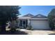 Charming single-story home with a well-maintained lawn and attached two-car garage at 2857 Woodruff Dr, Orlando, FL 32837