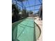 Large screened-in swimming pool surrounded by a spacious deck and privacy fence at 2857 Woodruff Dr, Orlando, FL 32837