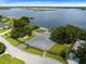 Aerial view of community park area featuring a playground, parking, and lake access at 2900 Cullen Lake Shore Dr, Belle Isle, FL 32812