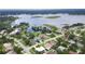 Aerial view of neighborhood featuring tree-lined streets and views of a lake at 2900 Cullen Lake Shore Dr, Belle Isle, FL 32812