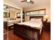 Bedroom with wood floors and mirror closet with window view at 2900 Cullen Lake Shore Dr, Belle Isle, FL 32812