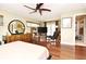 Bedroom with wooden floors, ceiling fan, and access to the outdoor covered patio at 2900 Cullen Lake Shore Dr, Belle Isle, FL 32812