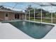 Outdoor swimming pool within a screened enclosure, overlooking the backyard at 2900 Cullen Lake Shore Dr, Belle Isle, FL 32812