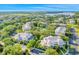 Aerial view of residential buildings and community pool with lush landscaping and surrounding neighborhood at 304 Rum Run # 304, Davenport, FL 33897