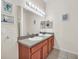 Bright bathroom featuring double sinks and ample counter space at 304 Rum Run # 304, Davenport, FL 33897