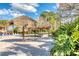 Sandy beach with shade canopies and beach chairs, creating a relaxing getaway at 304 Rum Run # 304, Davenport, FL 33897