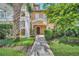Charming home entrance with landscaped walkway, leading to a welcoming front door with detailed trim at 304 Rum Run # 304, Davenport, FL 33897