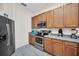 Charming kitchen with stainless steel appliances and natural wood cabinets at 304 Rum Run # 304, Davenport, FL 33897