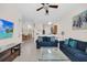 Cozy living room with ceiling fan, tile flooring, and open layout at 304 Rum Run # 304, Davenport, FL 33897