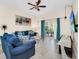Spacious living room with plush seating and a sliding glass door to the patio at 304 Rum Run # 304, Davenport, FL 33897