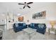 Bright living room featuring comfortable seating and tropical wall art at 304 Rum Run # 304, Davenport, FL 33897
