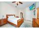 Comfortable main bedroom with TV, dresser, and neutral walls at 304 Rum Run # 304, Davenport, FL 33897