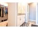 Bathroom featuring a vanity with granite countertops and a walk-in closet at 30498 Pintail Dr, Leesburg, FL 34748