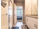 Bathroom featuring a vanity with granite countertops, a glass shower and bedroom access at 30498 Pintail Dr, Leesburg, FL 34748