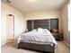 Comfortable bedroom featuring a gray upholstered headboard and neutral carpeting at 30498 Pintail Dr, Leesburg, FL 34748