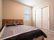 Comfortable bedroom with a window for natural light and a large closet at 30498 Pintail Dr, Leesburg, FL 34748