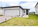 Charming single-Gathering home with a two-car garage, walkway, and well-maintained landscaping at 30498 Pintail Dr, Leesburg, FL 34748
