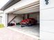 View of an open garage with a disassembled vehicle and various tools at 30498 Pintail Dr, Leesburg, FL 34748