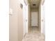 Hallway showcases tile floors, neutral paint, and multiple white doors at 30498 Pintail Dr, Leesburg, FL 34748