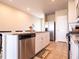 Well-lit kitchen featuring stainless steel appliances, granite countertops, and a convenient layout at 30498 Pintail Dr, Leesburg, FL 34748