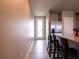 Modern kitchen featuring a breakfast bar with seating, granite countertops, and stainless steel appliances at 30498 Pintail Dr, Leesburg, FL 34748