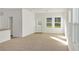 Bright living room with new carpet, large windows, and natural light at 3053 Daffodil Dr, Lake Hamilton, FL 33851