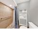 Bright bathroom featuring a walk-in shower with updated fixtures and a towel rack, enhanced by neutral tones and ample lighting at 311 Needles Trl, Longwood, FL 32779
