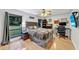 Cozy bedroom showcasing a comfortable bed, complemented by a ceiling fan and expansive windows offering serene outdoor views at 311 Needles Trl, Longwood, FL 32779