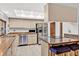 Kitchen features granite countertops, stainless steel appliances and a breakfast bar with seating at 311 Needles Trl, Longwood, FL 32779