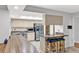 Kitchen features granite countertops, stainless steel appliances and a breakfast bar with seating at 311 Needles Trl, Longwood, FL 32779