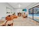 Bright living room boasts a fireplace and sliding glass doors with pool views at 311 Needles Trl, Longwood, FL 32779