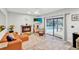 Bright living room boasts a fireplace and sliding glass doors with pool views at 311 Needles Trl, Longwood, FL 32779