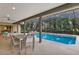 Relaxing screened pool area with ample patio space for dining and lounging while enjoying the backyard views at 311 Needles Trl, Longwood, FL 32779