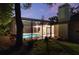 Screened in pool area featuring chaise lounges and well-maintained landscaping, with an attached house at 311 Needles Trl, Longwood, FL 32779