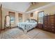 Comfortable bedroom with natural light, a vaulted ceiling and cozy decor at 3131 Juniper Dr, Edgewater, FL 32141