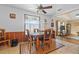 Cozy dining area featuring wood table, and bright window, perfect for Gathering meals at 3131 Juniper Dr, Edgewater, FL 32141
