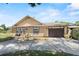 Beautiful home featuring a paved driveway, well-manicured lawn, and attached garage at 3131 Juniper Dr, Edgewater, FL 32141