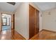 Hallway with hardwood floors and natural lighting at 3131 Juniper Dr, Edgewater, FL 32141