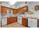 Kitchen featuring wood cabinets, modern appliances, and ample counter space at 3131 Juniper Dr, Edgewater, FL 32141