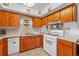 Kitchen featuring wood cabinets, modern appliances, and ample counter space at 3131 Juniper Dr, Edgewater, FL 32141