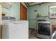 A functional laundry room with modern washer and dryer at 3131 Juniper Dr, Edgewater, FL 32141