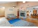 Spacious living room featuring a fireplace and seamless flow to the adjacent dining area at 3131 Juniper Dr, Edgewater, FL 32141