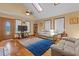 Bright living room featuring hardwood floors, skylights, and comfortable seating at 3131 Juniper Dr, Edgewater, FL 32141