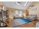 Bright living room with hardwood floors, skylights, and comfortable seating arrangement at 3131 Juniper Dr, Edgewater, FL 32141