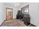 This office features a dark wood desk and cabinets with a view to the hallway at 3131 Juniper Dr, Edgewater, FL 32141