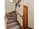 Classic staircase with wood accents and a carpet runner at 3131 Juniper Dr, Edgewater, FL 32141