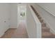 Hallway with carpeted stairs leading to the second floor at 3394 Vesara Dr, Davenport, FL 33837